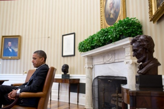 Sept. 28, 2012
"A candid portrait of the President during a meeting, juxtaposed with the paintings of Abraham Lincoln and George Washington, busts of Martin Luther King, Jr. and Abraham Lincoln, and the Emancipation Proclamation. It's a difficult angle to get because I had to sit in front of the closed Oval Office door and hope that no one would open the door and knock me over." 
(Official White House Photo by Pete Souza)

This official White House photograph is being made available only for publication by news organizations and/or for personal use printing by the subject(s) of the photograph. The photograph may not be manipulated in any way and may not be used in commercial or political materials, advertisements, emails, products, promotions that in any way suggests approval or endorsement of the President, the First Family, or the White House.